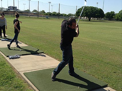 Ahsan hitting the ball off the course during Central Station Marketing's team outing