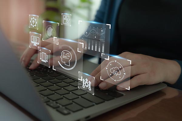 Man operating Laptop, showing some grpahics on the image